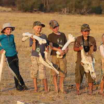100. Imvelo Safari Lodges - Camelthorn - Kids having fun with some giraffe bones